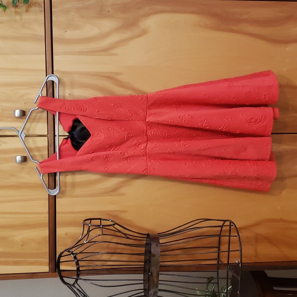 Sweetheart neckline, cutout back fit flare dress.